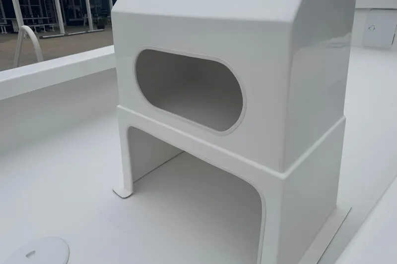 Slide: The Image of 2026 C-Hawk 23 Center Console boat detail, featuring a sleek white console design. - 6