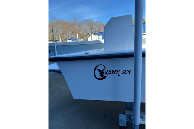 Slide: The Image of 2026 C-Hawk 23 Center Console boat with logo, parked outdoors. - 8
