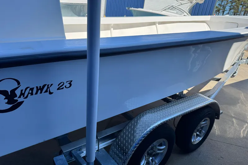 Slide: The Image of 2026 C-Hawk 23 Center Console boat on a trailer, side view. - 9