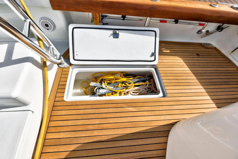 Slide: The Image of Open storage compartment on 2014 Release Walkaround boat deck with ropes inside. - 12