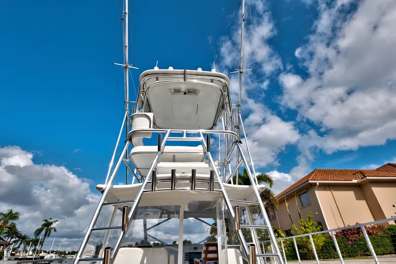Slide: The Image of 2014 Release Walkaround boat with tower against blue sky and clouds. - 14
