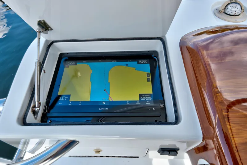 Slide: The Image of Garmin navigation system on 2014 Release Walkaround boat, displaying nautical map. - 25