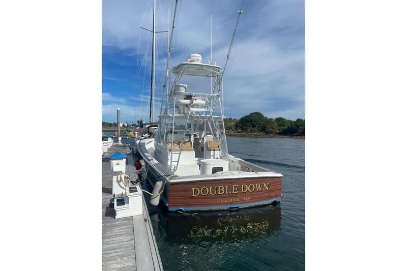 Slide: The Image of 2014 Release Walkaround boat "Double Down" docked in Gloucester, MA, under clear skies. - 3