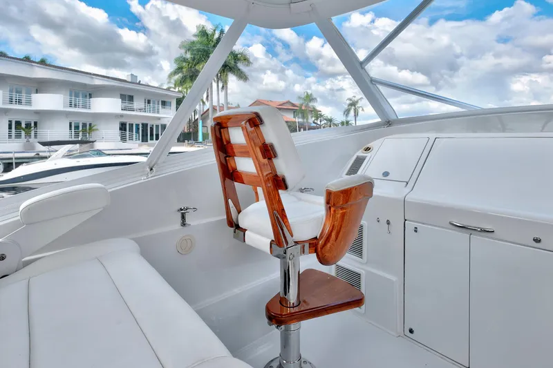 Slide: The Image of Luxurious 2014 Release Walkaround boat interior with white seating and wooden accents. - 32