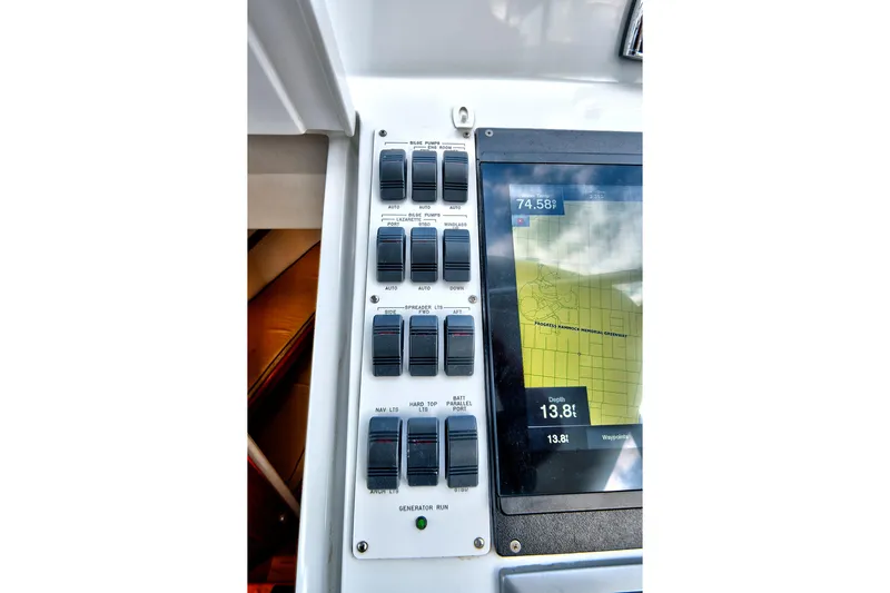 Slide: The Image of Control panel and navigation screen on a 2014 Release Walkaround boat. - 33