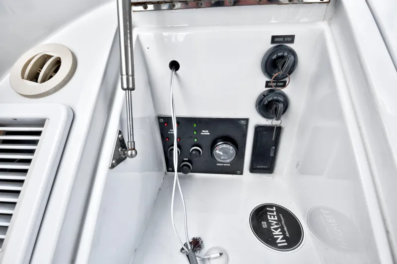 Slide: The Image of Control panel of a 2014 Release Walkaround boat with gauges and switches. - 34
