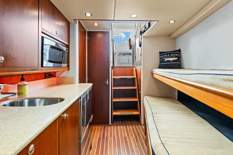 Slide: The Image of Luxurious 2014 Release Walkaround yacht interior with kitchenette and bunk beds. - 37