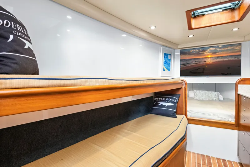 Slide: The Image of Luxurious 2014 Release Walkaround yacht interior with cozy bunks and elegant wood finishes. - 46