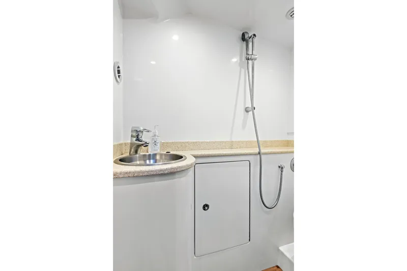 Slide: The Image of Modern boat bathroom with sink, shower, and storage in 2014 Release Walkaround model. - 49