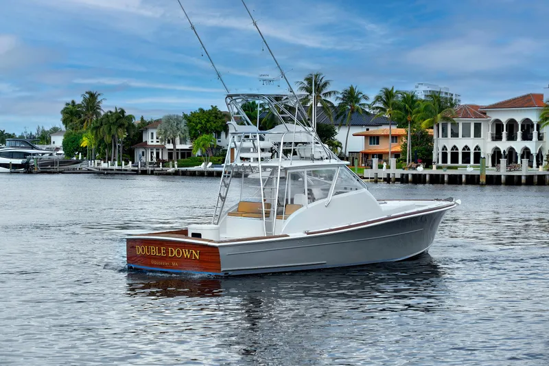 Slide: The Image of 2014 Release Walkaround boat "Double Down" on water near luxury waterfront homes. - 5