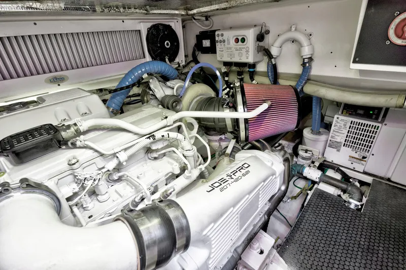 Slide: The Image of Engine room of a 2014 Release Walkaround boat, featuring a powerful marine engine. - 56