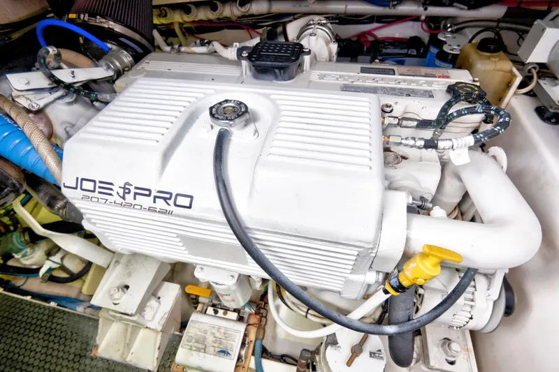 Slide: The Image of Engine compartment of a 2014 Release Walkaround boat, featuring a Joe Pro engine. - 57