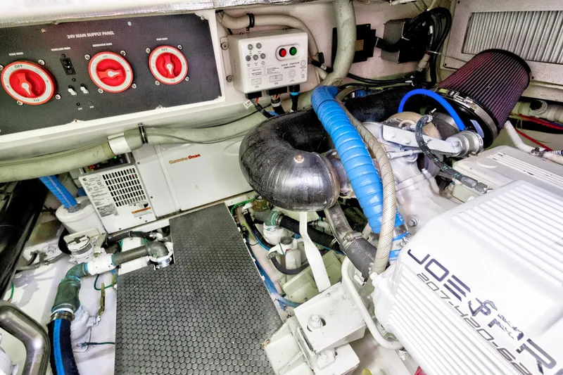 Slide: The Image of Engine room of a 2014 Release Walkaround boat with visible components and wiring. - 58