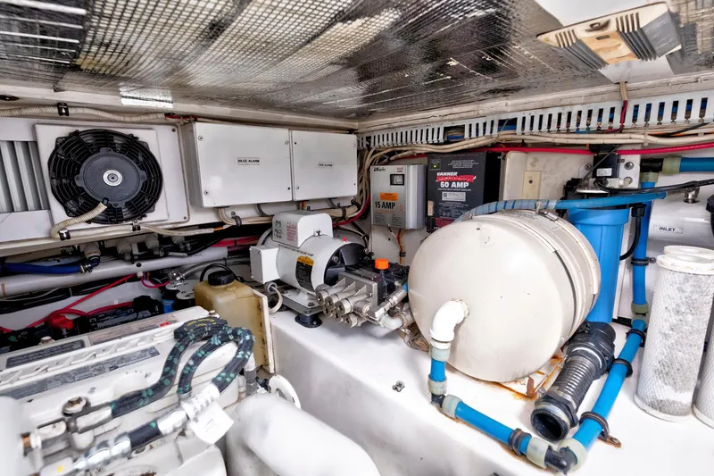 Slide: The Image of Engine room of a 2014 Release Walkaround boat with various mechanical components. - 59