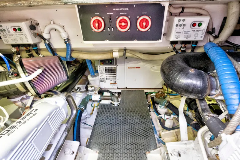 Slide: The Image of Engine room of 2014 Release Walkaround boat with Cummins Onan generator and control panels. - 60