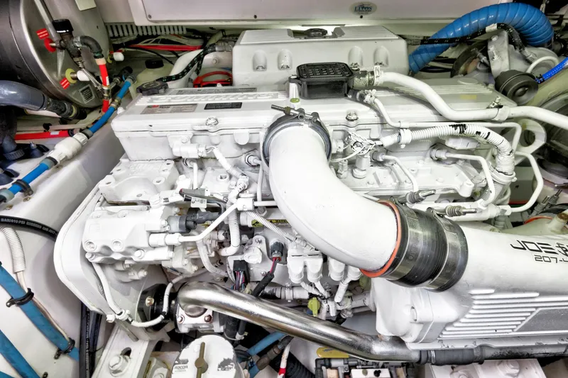 Slide: The Image of Engine compartment of a 2014 Release Walkaround boat, showcasing detailed mechanical components. - 61