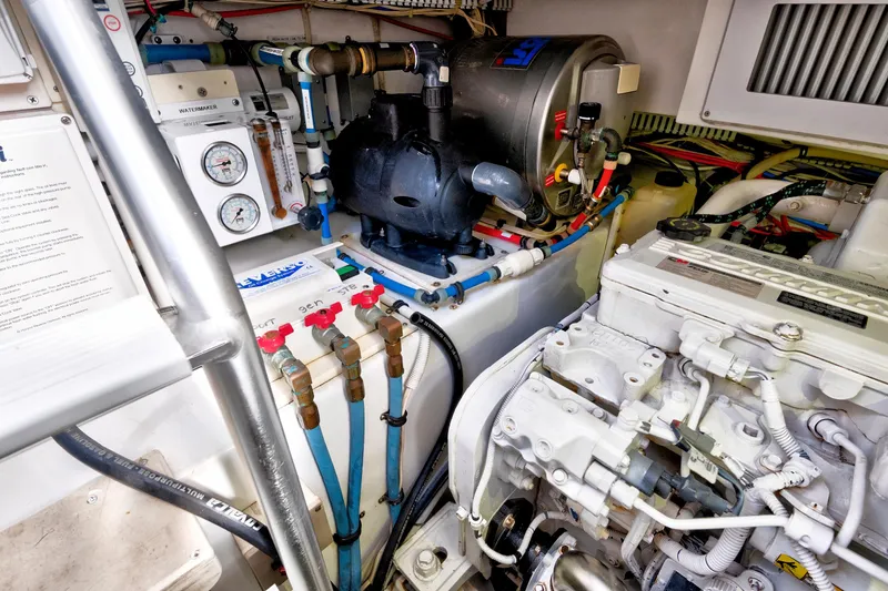Slide: The Image of Engine room of a 2014 Release Walkaround boat, featuring mechanical components and gauges. - 62