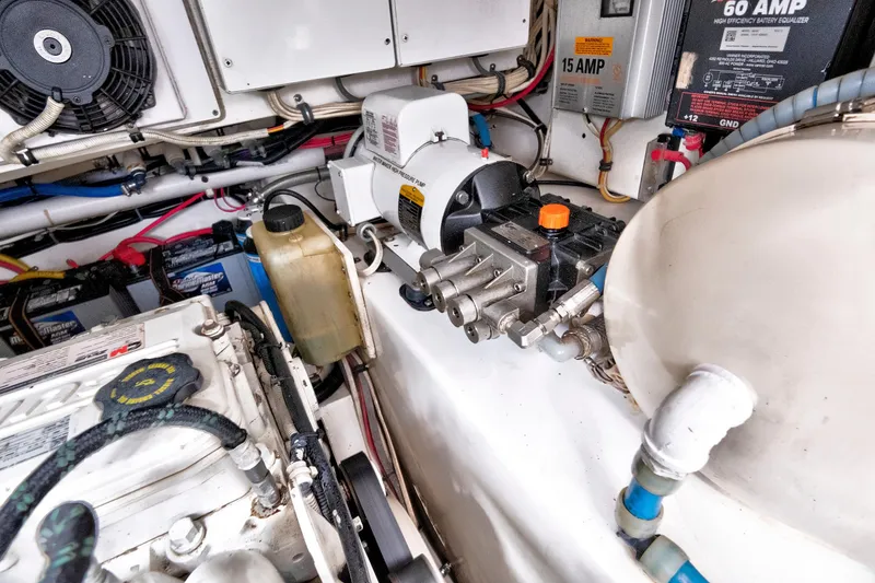 Slide: The Image of Engine room of a 2014 Release Walkaround boat with mechanical components and wiring. - 65