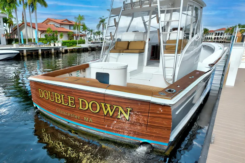 Slide: The Image of 2014 Release Walkaround boat "Double Down" docked in a scenic marina. - 7