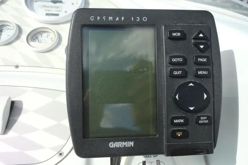Slide: The Image of Garmin GPSMAP 130 on 1998 Baja 29 Outlaw boat dashboard. - 10