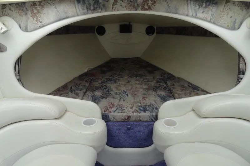 Slide: The Image of Interior cabin of a 1998 Baja 29 Outlaw boat with patterned upholstery. - 19