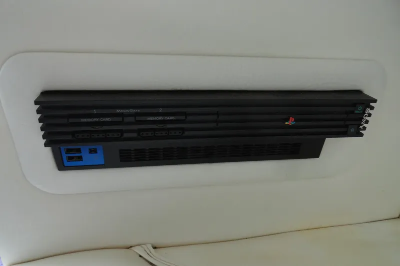 Slide: The Image of Built-in PlayStation 2 console in 1998 Baja 29 Outlaw boat interior. - 21