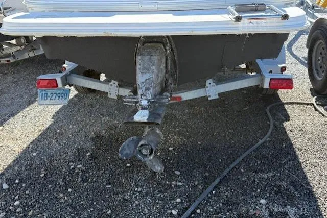 Slide: The Image of 2009 Glastron GT 185 boat on trailer, rear view showing propeller and license plate. - 12