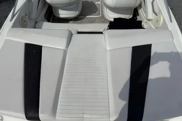 Slide: The Image of 2009 Glastron GT 185 boat interior with white and black seating. - 5