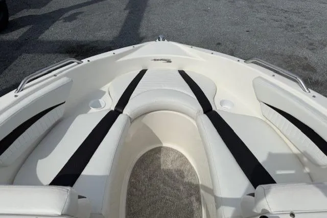 Slide: The Image of 2009 Glastron GT 185 boat interior with white and black seating. - 7