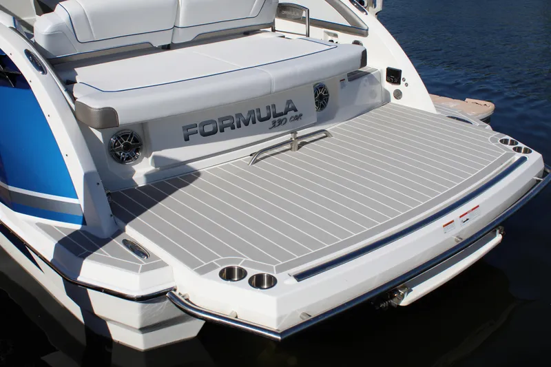 Slide: The Image of 2023 Formula 330 Crossover Bowrider boat with spacious rear deck and seating. - 16