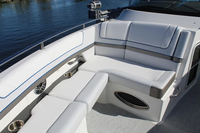 Slide: The Image of 2023 Formula 330 Crossover Bowrider interior with luxurious seating and cup holders. - 20