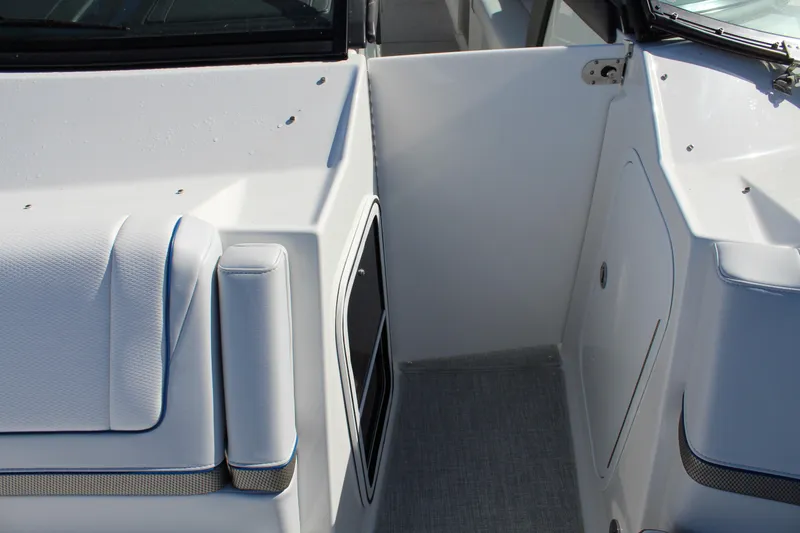 Slide: The Image of 2023 Formula 330 Crossover Bowrider interior, featuring sleek white seating and modern design. - 21