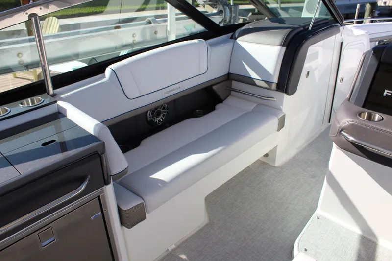 Slide: The Image of 2023 Formula 330 Crossover Bowrider interior with sleek seating and modern design. - 25