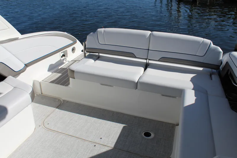 Slide: The Image of 2023 Formula 330 Crossover Bowrider interior with spacious seating by the water. - 26