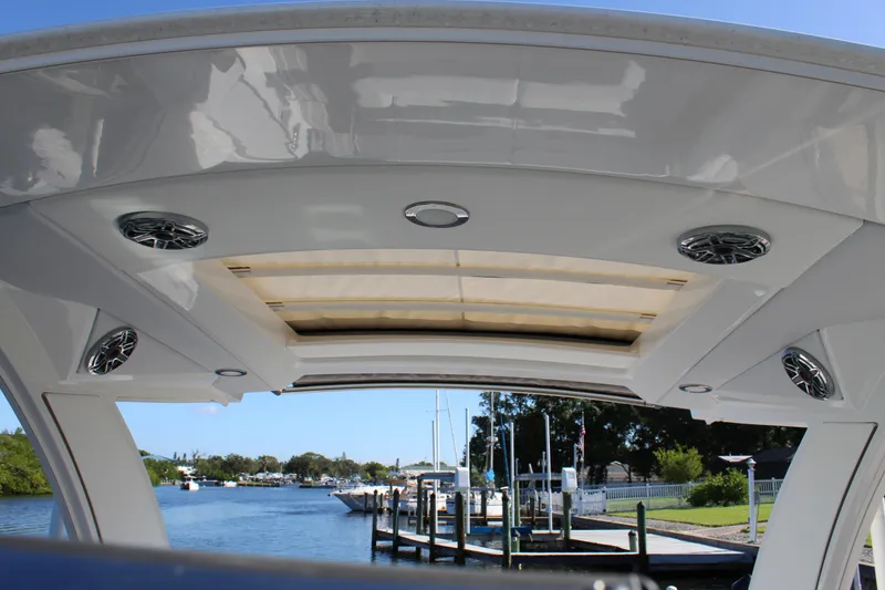 Slide: The Image of 2023 Formula 330 Crossover Bowrider interior view with speakers and sunroof. - 32