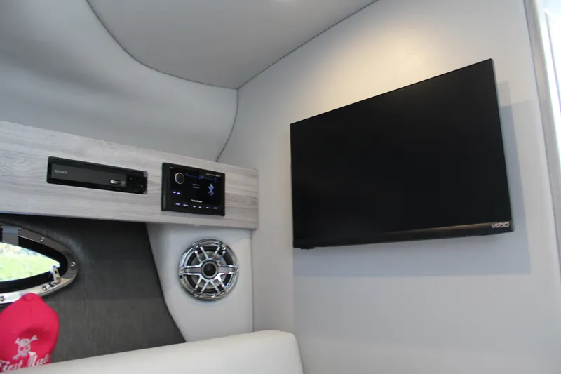 Slide: The Image of 2023 Formula 330 Crossover Bowrider interior with TV and audio system. - 38