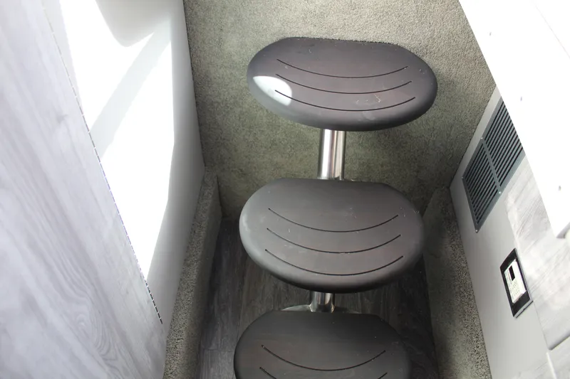 Slide: The Image of 2023 Formula 330 Crossover Bowrider interior steps, modern design, compact space. - 40