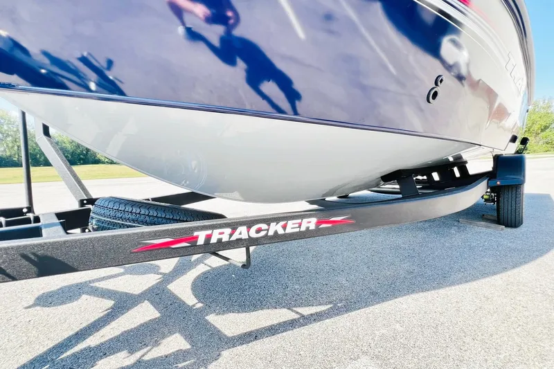 Slide: The Image of 2024 Tracker Targa V-18 Combo boat on trailer, close-up view. - 12