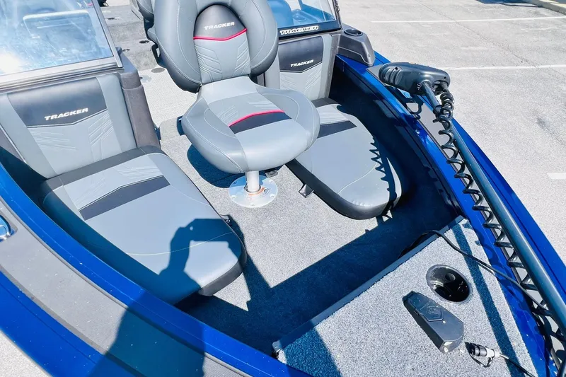 Slide: The Image of 2024 Tracker Targa V-18 Combo boat interior with seating and control panel. - 18