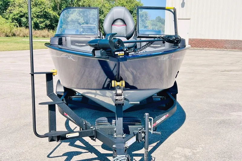 Slide: The Image of 2024 Tracker Targa V-18 Combo boat on trailer, parked outdoors. - 24