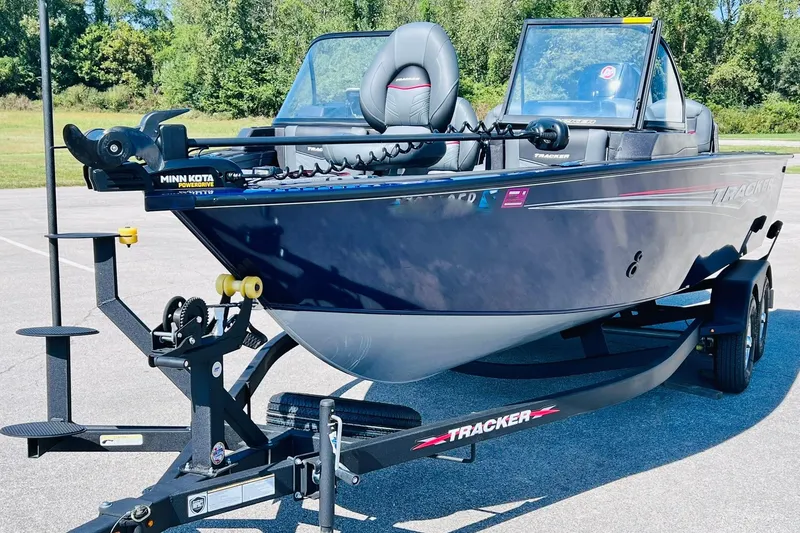 Slide: The Image of 2024 Tracker Targa V-18 Combo boat on trailer, featuring Minn Kota PowerDrive motor. - 25
