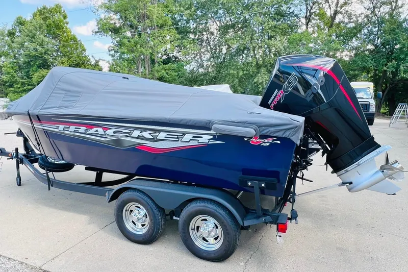 Slide: The Image of 2024 Tracker Targa V-18 Combo boat with cover and powerful outboard motor. - 26