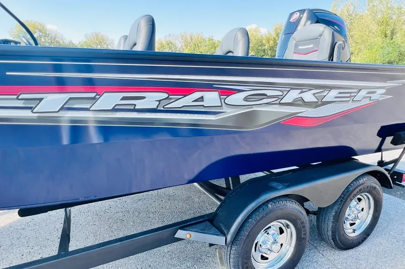 Slide: The Image of 2024 Tracker Targa V-18 Combo boat on trailer, side view with logo. - 37