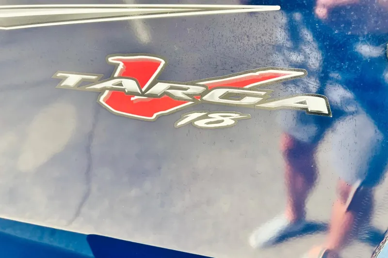 Slide: The Image of 2024 Tracker Targa V-18 Combo logo on a reflective blue surface. - 38