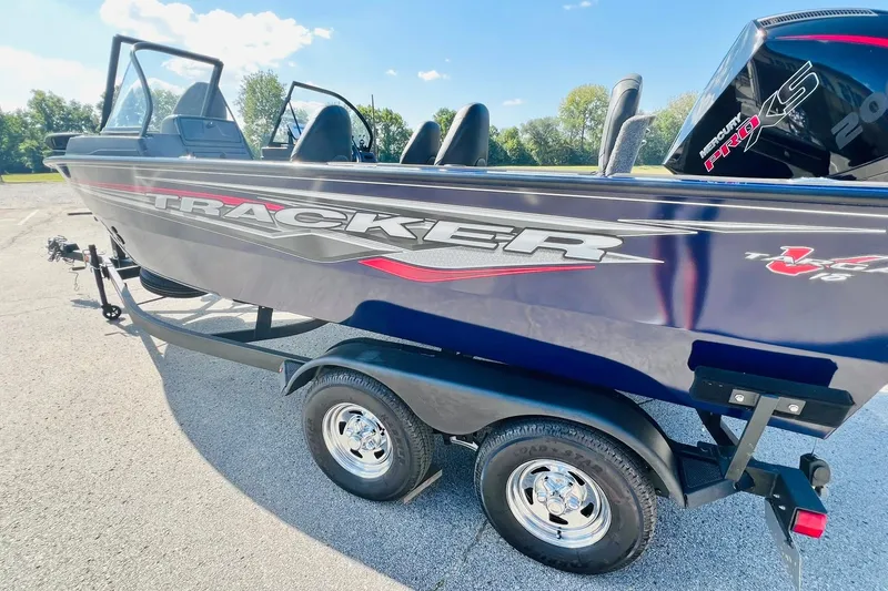 Slide: The Image of 2024 Tracker Targa V-18 Combo boat on trailer, featuring sleek design and Mercury Pro XS engine. - 6