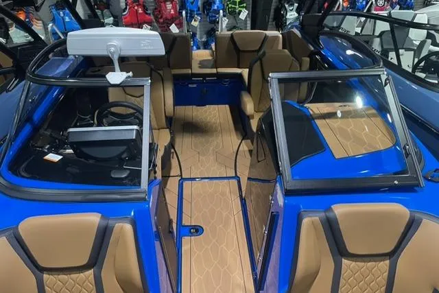 Slide: The Image of 2024 Yamaha Boats 255XD interior with tan seating and blue accents. - 12