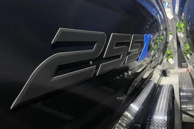 Slide: The Image of 2024 Yamaha Boats 255XD logo on sleek black hull. - 2