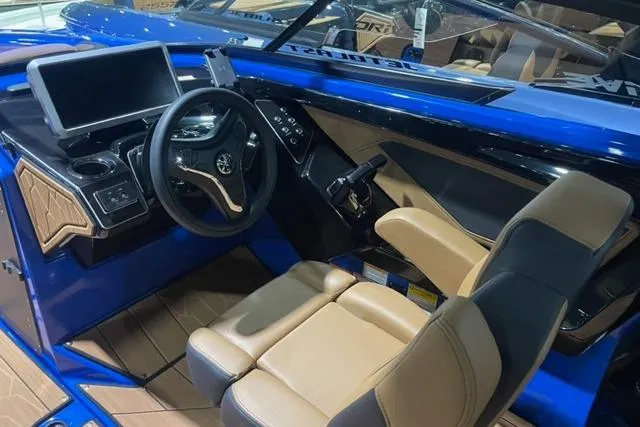 Slide: The Image of 2024 Yamaha Boats 255XD interior with modern dashboard and comfortable seating. - 6