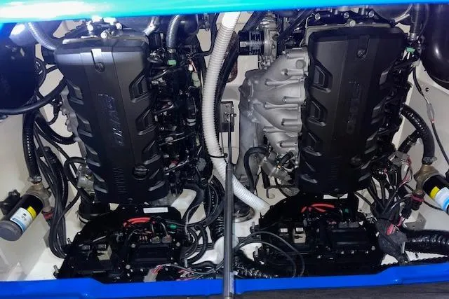 Slide: The Image of 2024 Yamaha Boats 255XD engine compartment with dual engines and intricate wiring. - 8