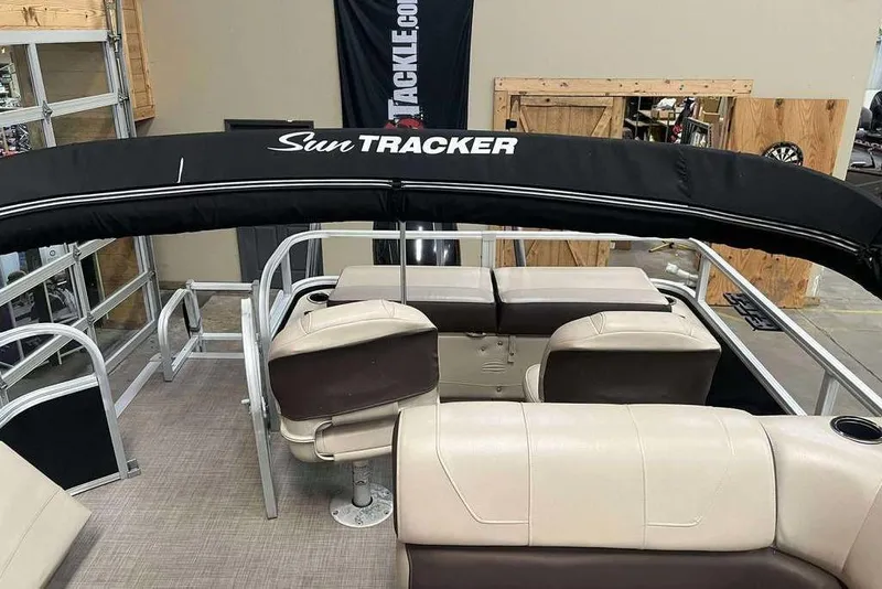Slide: The Image of 2018 Sun Tracker SportFish 22 XP3 pontoon boat interior with seating and canopy. - 4